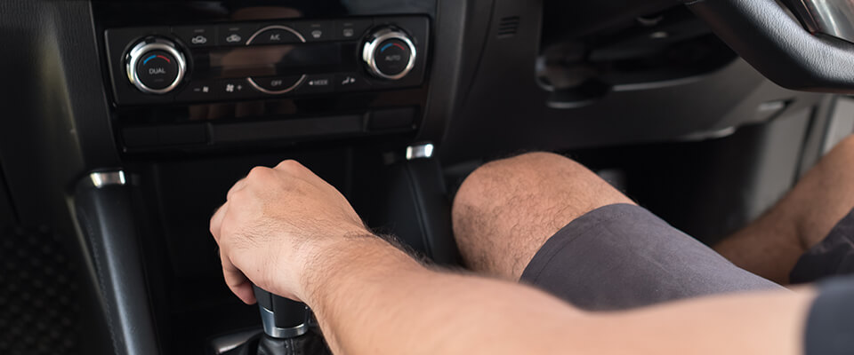 Close up of hand on gear stick